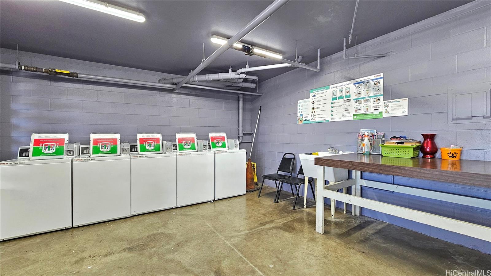 955 Ala Lilikoi Street, Unit 502 Honolulu, HI 96818 - Photo 20 of 21 a room with wooden cabinets and furniture