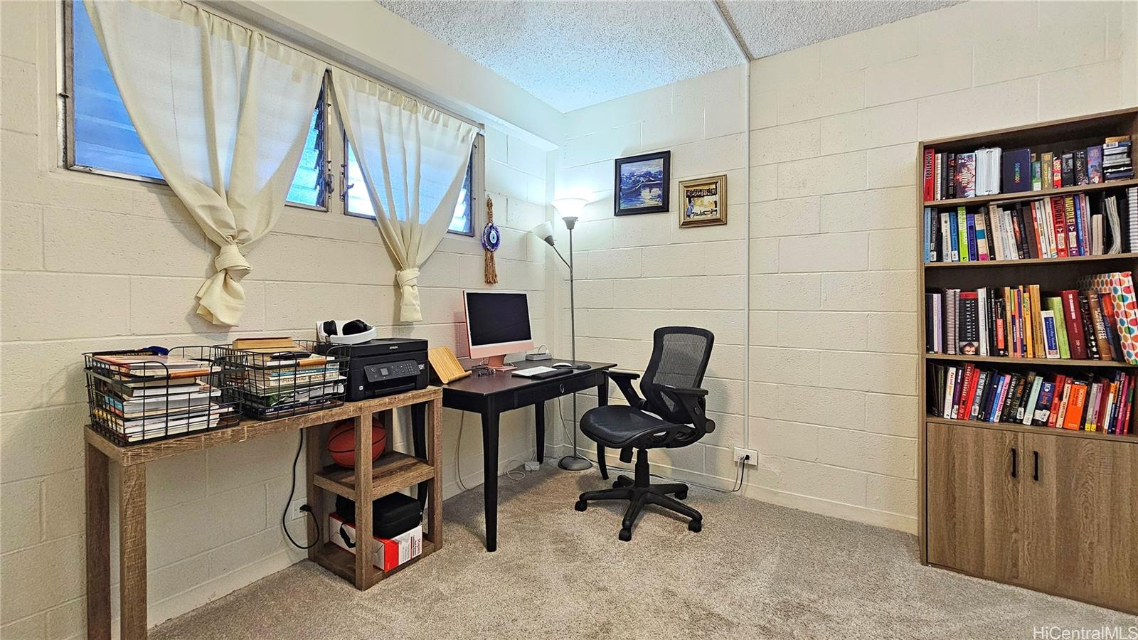 955 Ala Lilikoi Street, Unit 502 Honolulu, HI 96818 - Photo 10 of 21 a view of workspace with lounge chair and book shelf