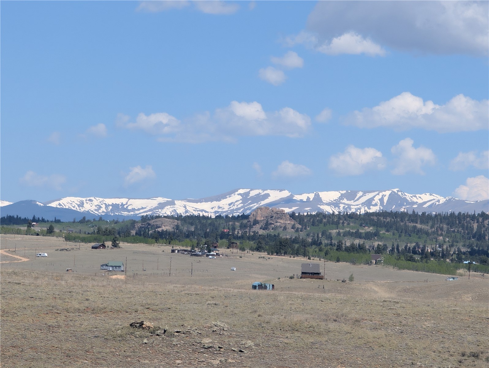 412 Andesite Way Como, CO 80432 - Photo 7 of 22 a view of a dry yard with mountain