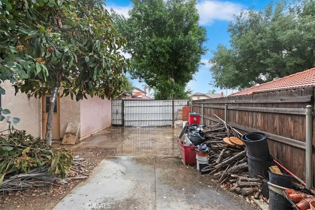 a view of a garage with wooden fence