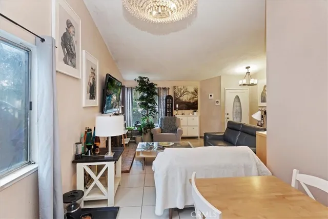 a living room with furniture a rug and a painting on the wall