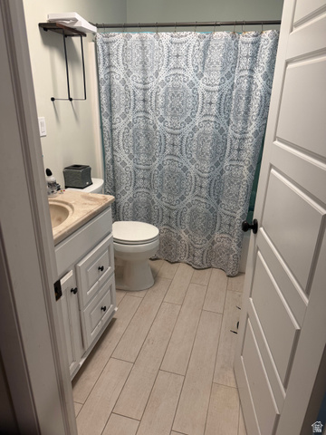 287 100 North Orem, UT 84057 - Photo 14 of 18 Bathroom with vanity, a shower with curtain, and wood tiled floors