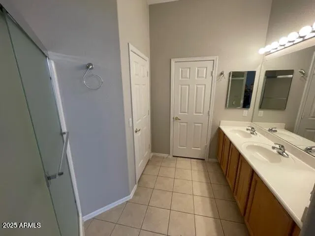 a bathroom with a sink a toilet a mirror and vanity
