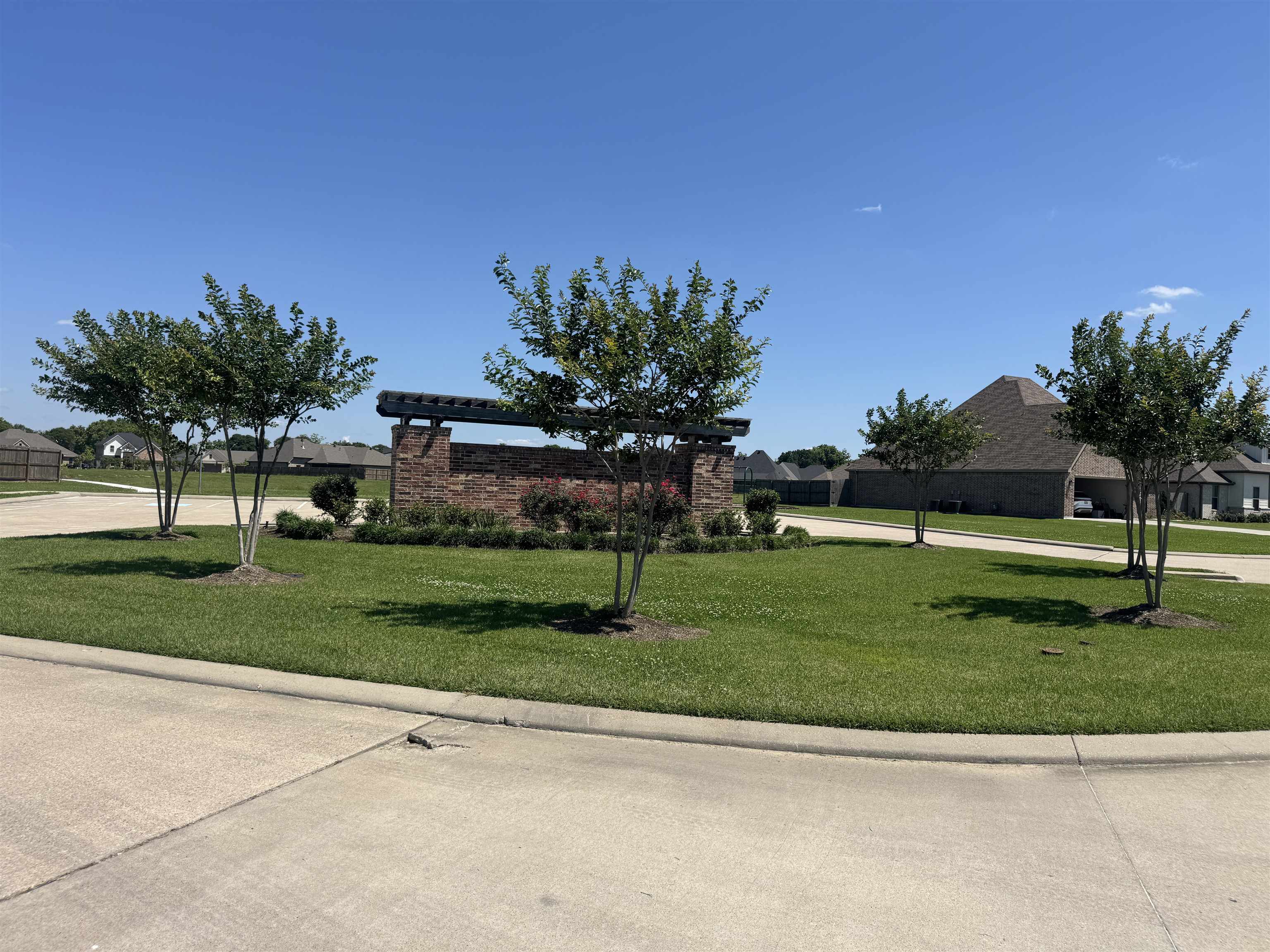 5000 Augusta Drive Groves, TX 77619 - Photo 3 of 3 a view of a garden with a building in the background