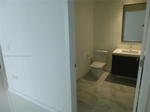 a bathroom with a toilet and a sink