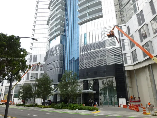 a view of a hallway with seating area