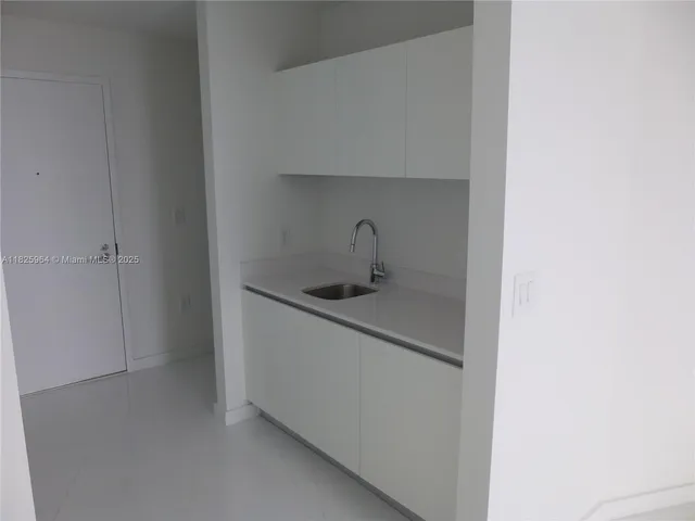 a utility room with a sink