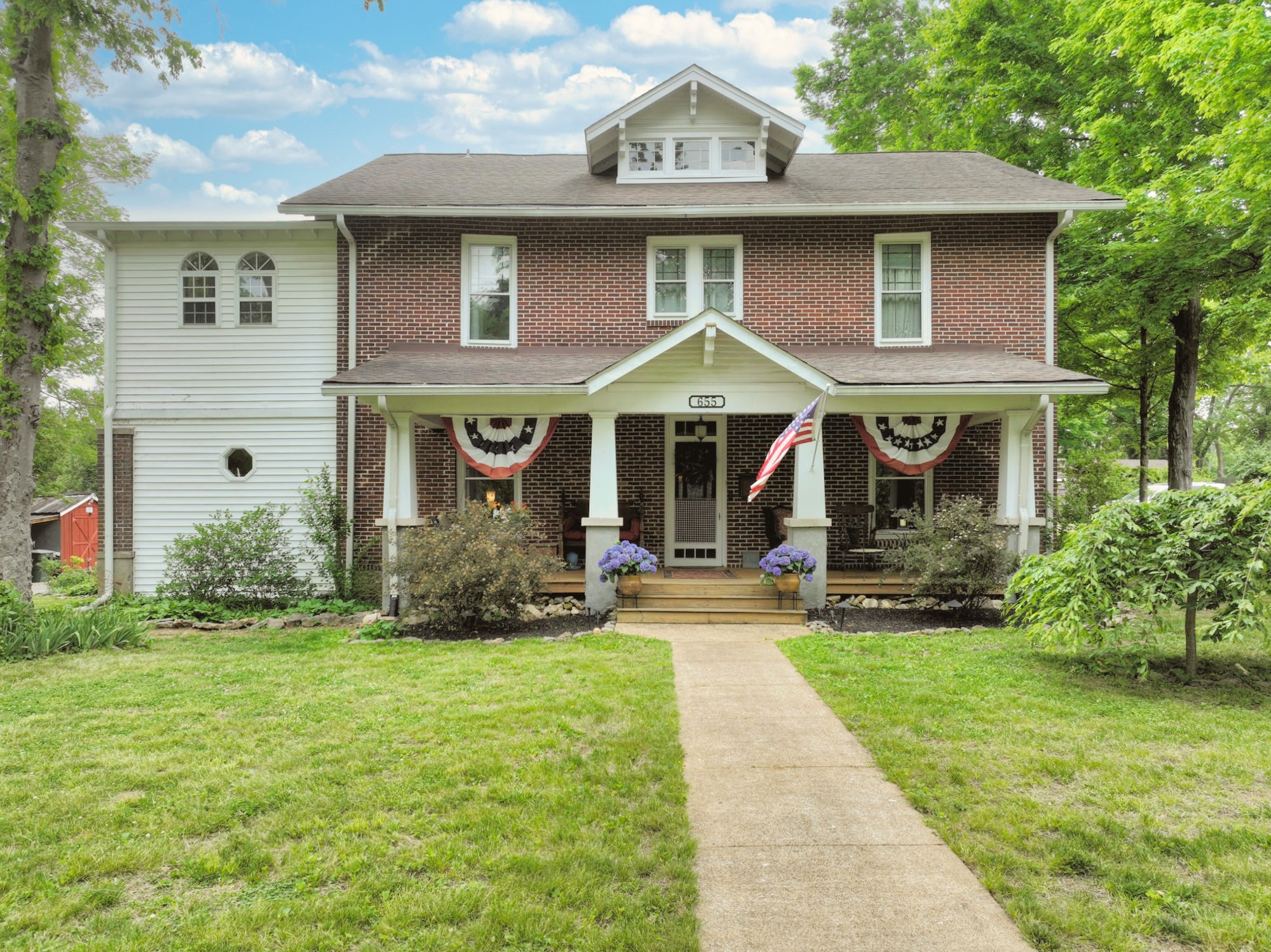 655 East Main Street Gallatin, TN 37066 - Photo 1 of 84 a front view of a house with a yard