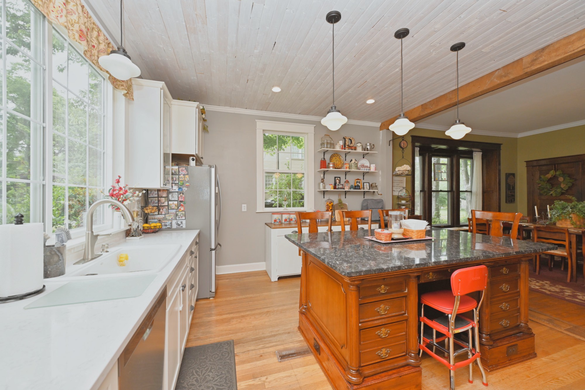 655 East Main Street Gallatin, TN 37066 - Photo 20 of 84 a dining hall with stainless steel appliances granite countertop a sink a stove and a wooden floors