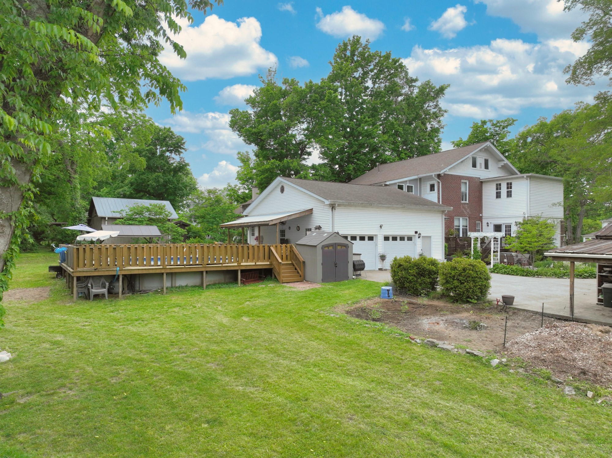 655 East Main Street Gallatin, TN 37066 - Photo 70 of 84 a view of a house with a yard and sitting area