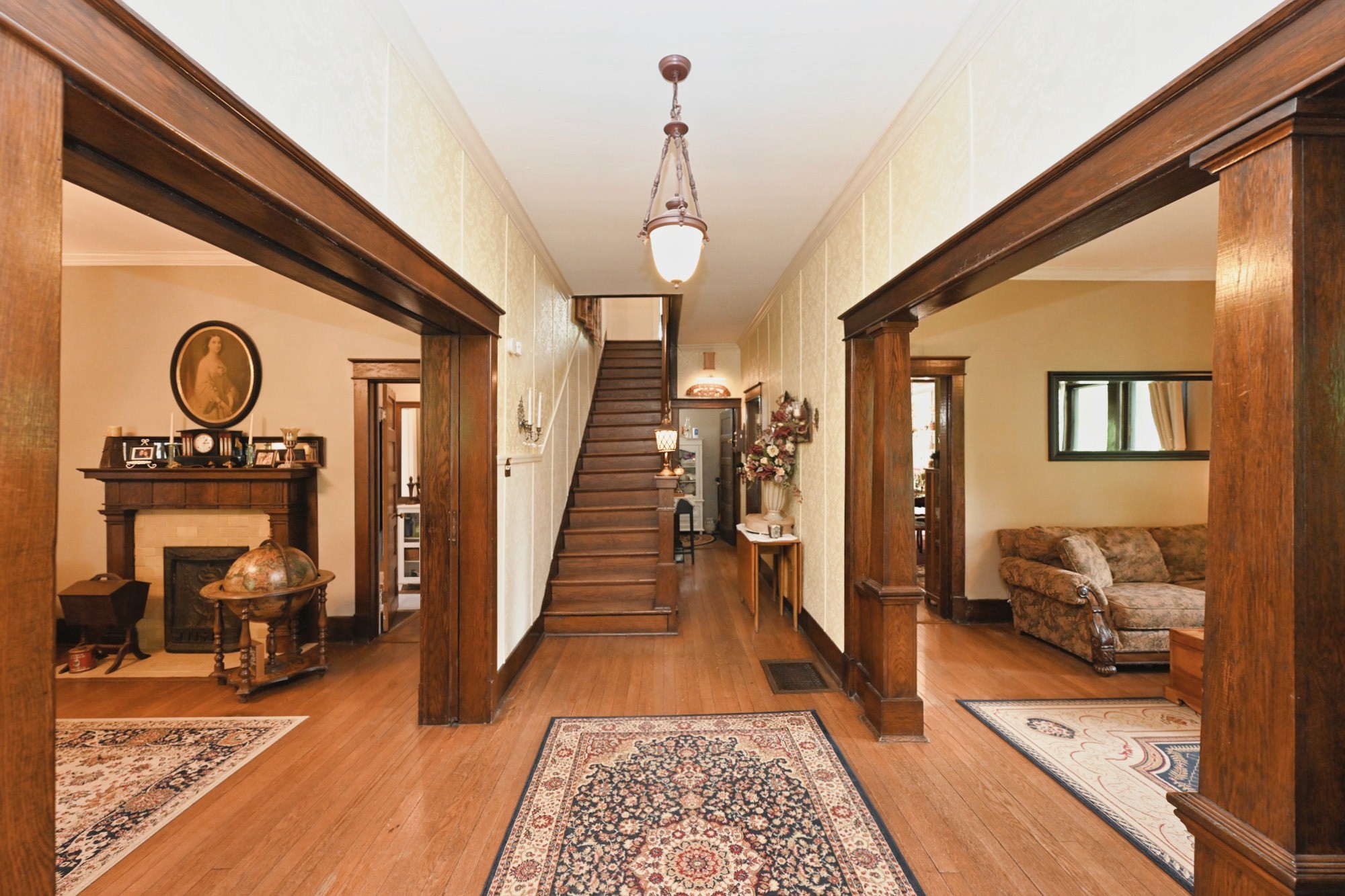 655 East Main Street Gallatin, TN 37066 - Photo 8 of 84 a view of a hallway to a livingroom with wooden floor and furniture