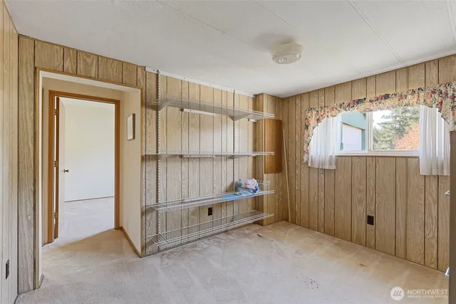 a view of entryway with wooden floor and door