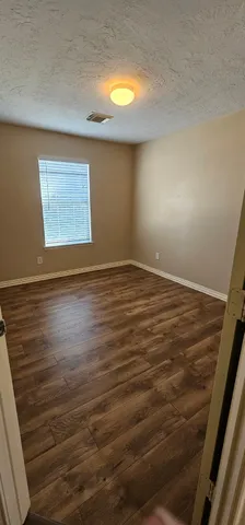 a bathroom with a granite countertop bathtub toilet and sink