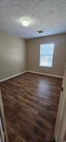 a view of house with yard and outdoor