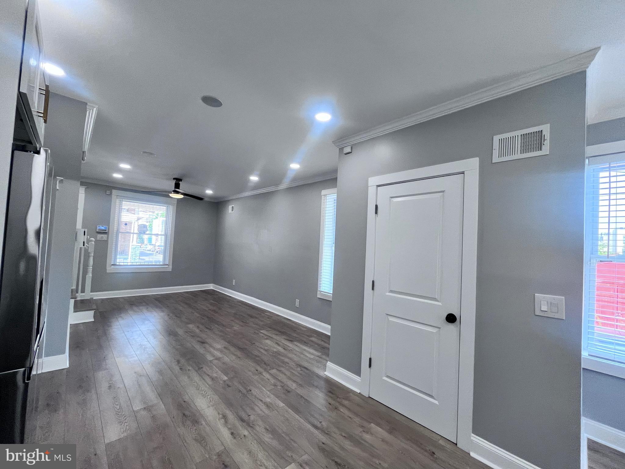 2520 West Seybert Street Philadelphia, PA 19121 - Photo 12 of 40 an empty room with wooden floor and a window