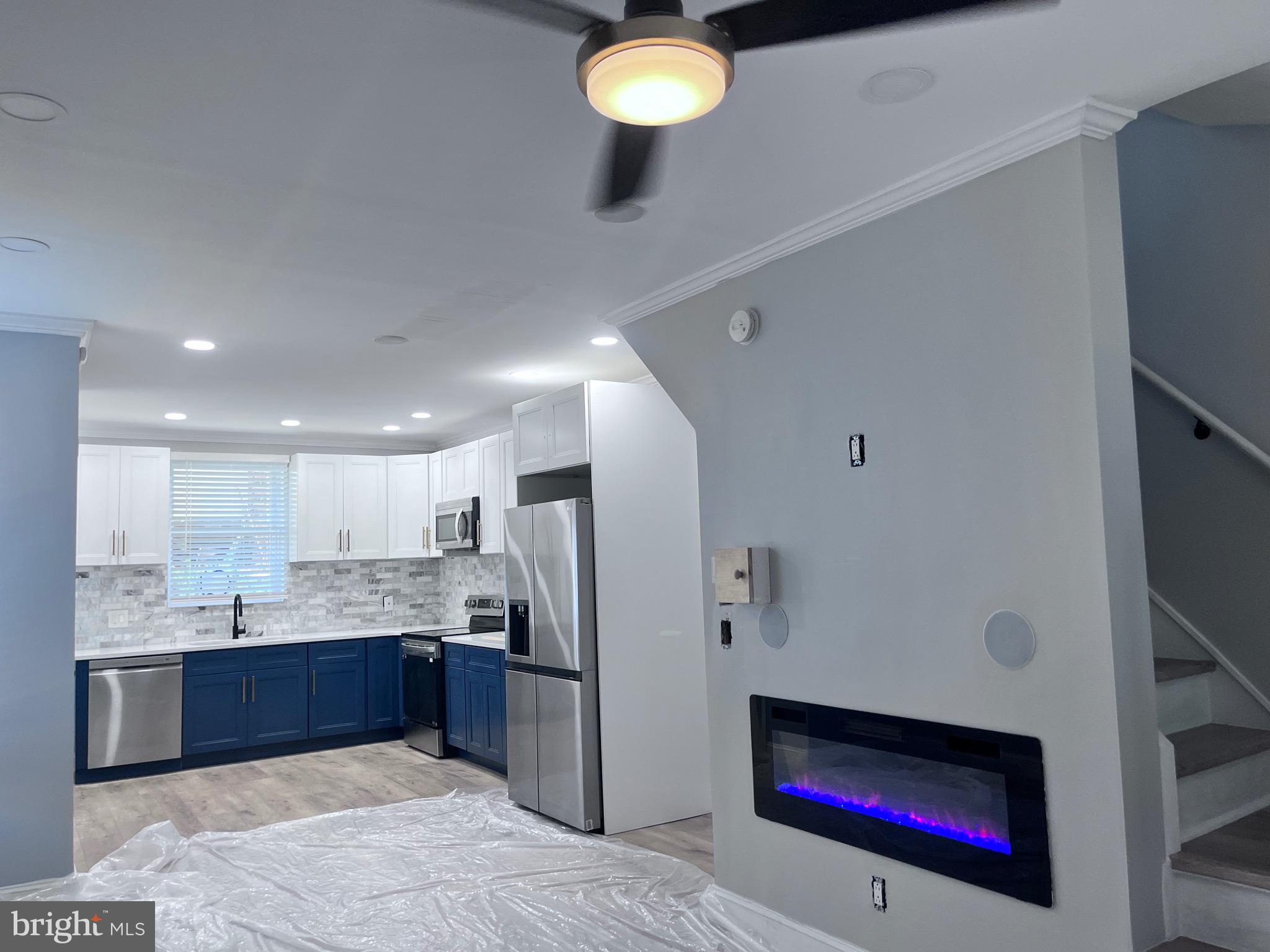 2520 West Seybert Street Philadelphia, PA 19121 - Photo 13 of 40 a kitchen with stainless steel appliances granite countertop a refrigerator and a sink