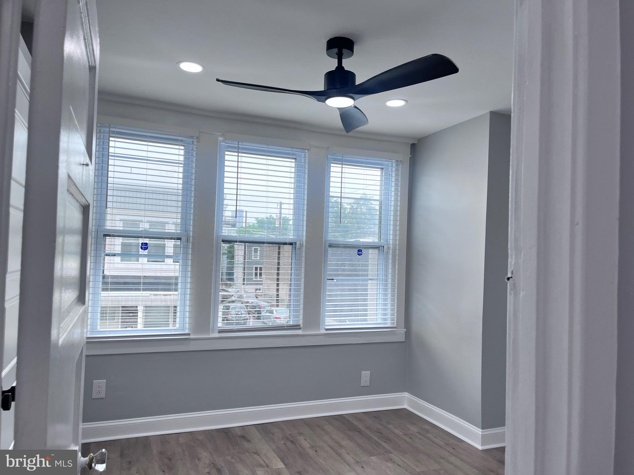 2520 West Seybert Street Philadelphia, PA 19121 - Photo 25 of 40 a view of an empty room with a window and wooden floor