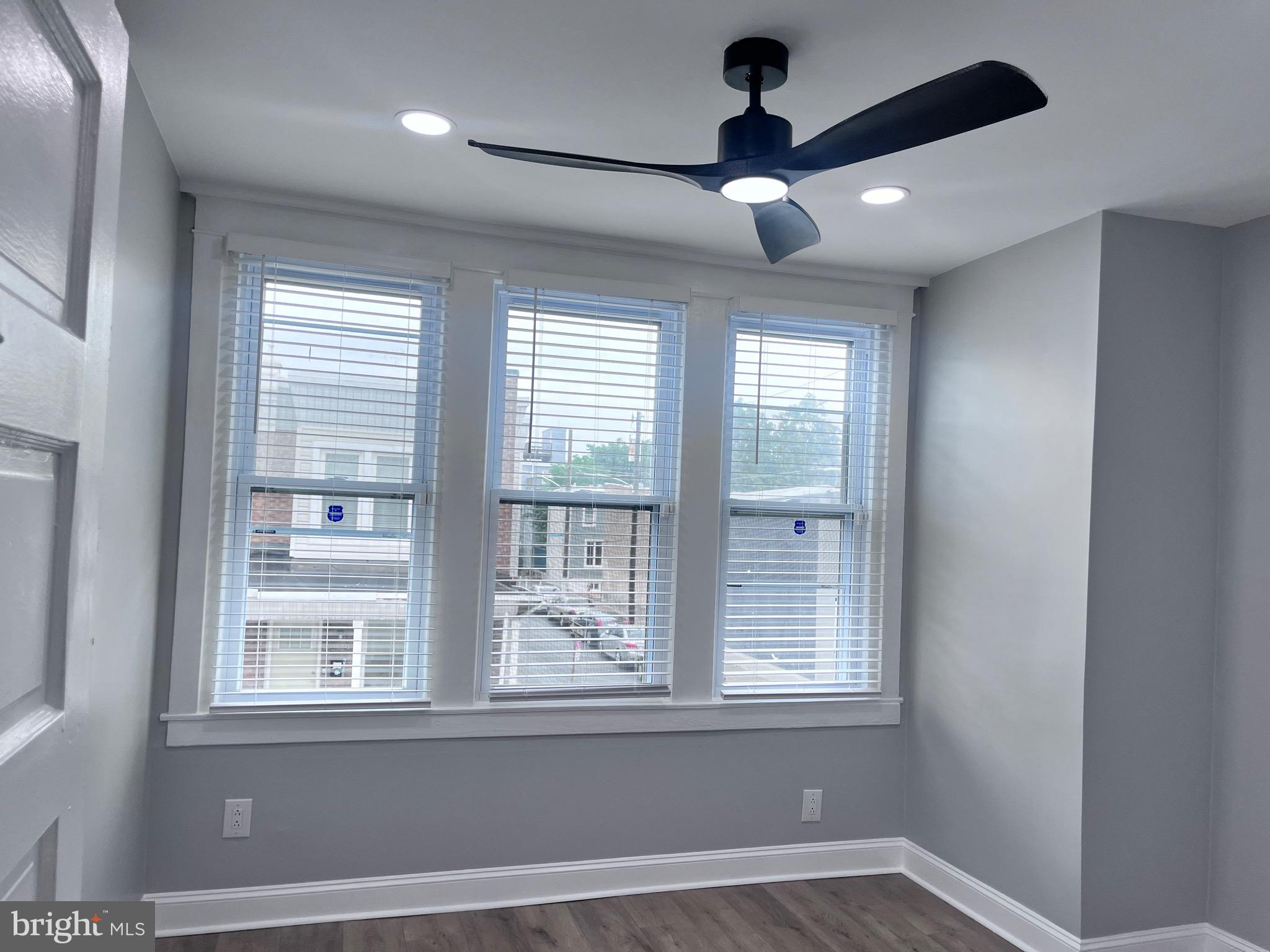 2520 West Seybert Street Philadelphia, PA 19121 - Photo 29 of 40 a view of an empty room with a window and a ceiling fan