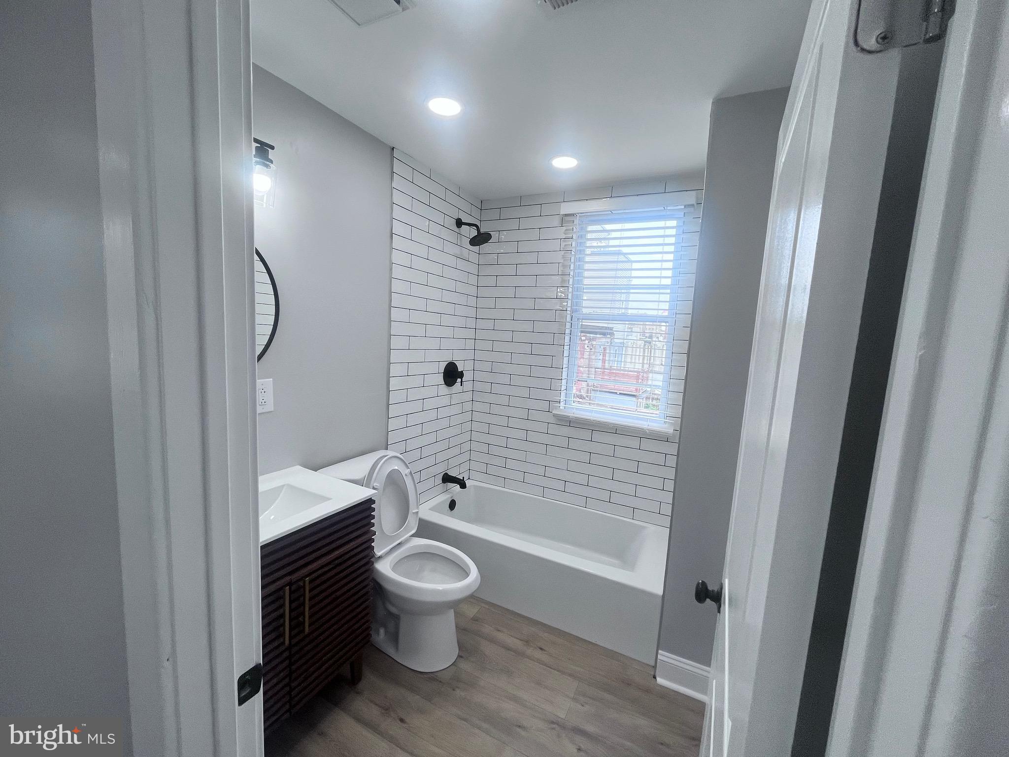 2520 West Seybert Street Philadelphia, PA 19121 - Photo 30 of 40 a bathroom with a toilet a sink and bathtub
