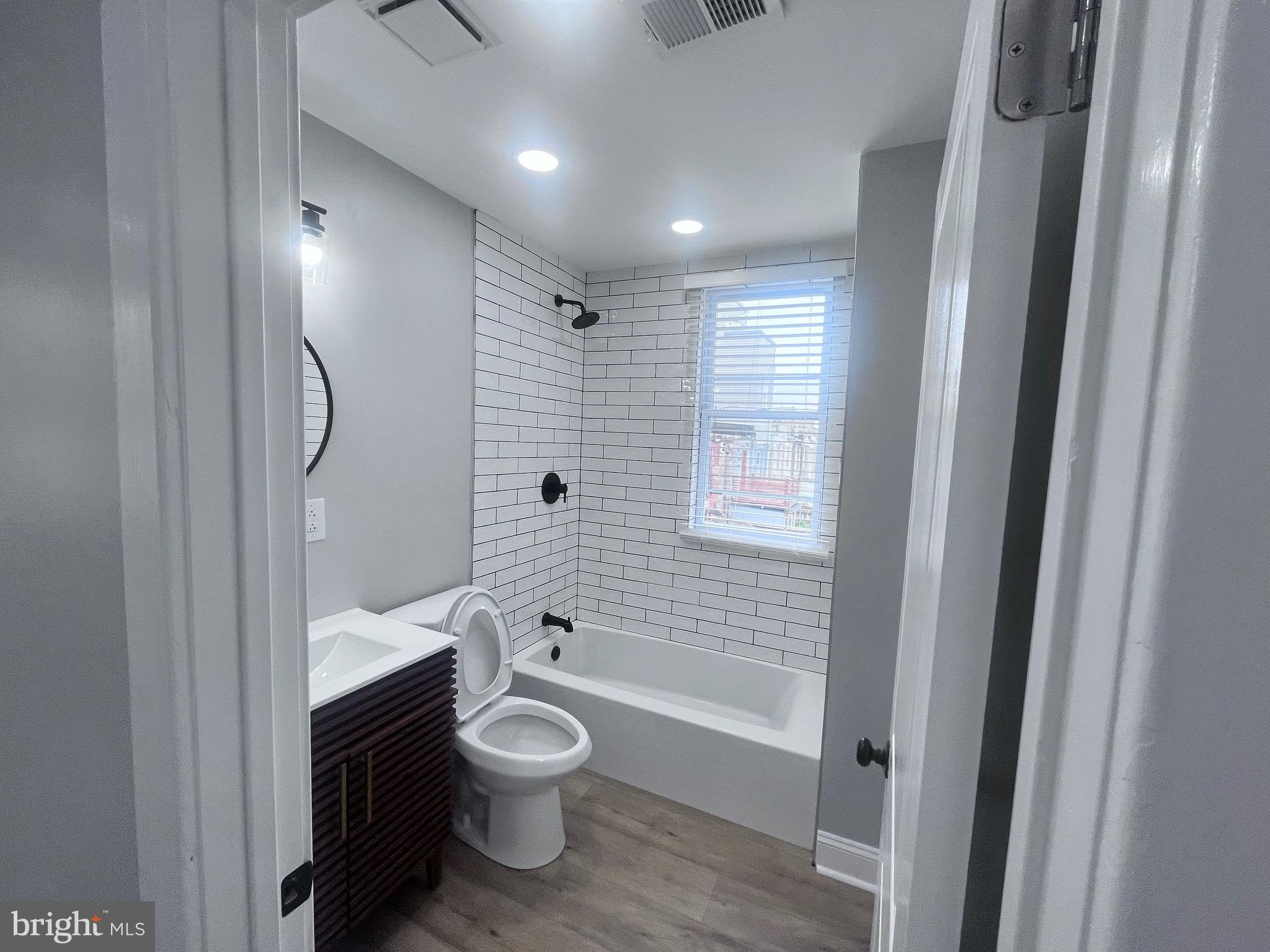 2520 West Seybert Street Philadelphia, PA 19121 - Photo 33 of 40 a bathroom with a toilet a sink and bathtub