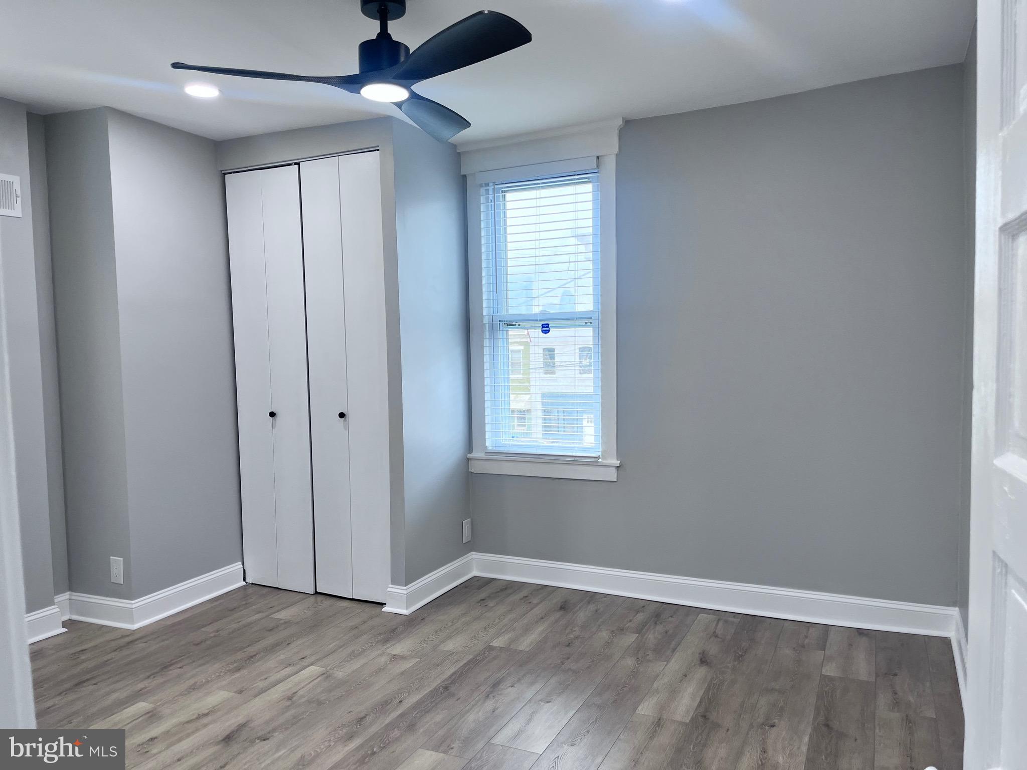 2520 West Seybert Street Philadelphia, PA 19121 - Photo 37 of 40 wooden floor in an empty room with a window