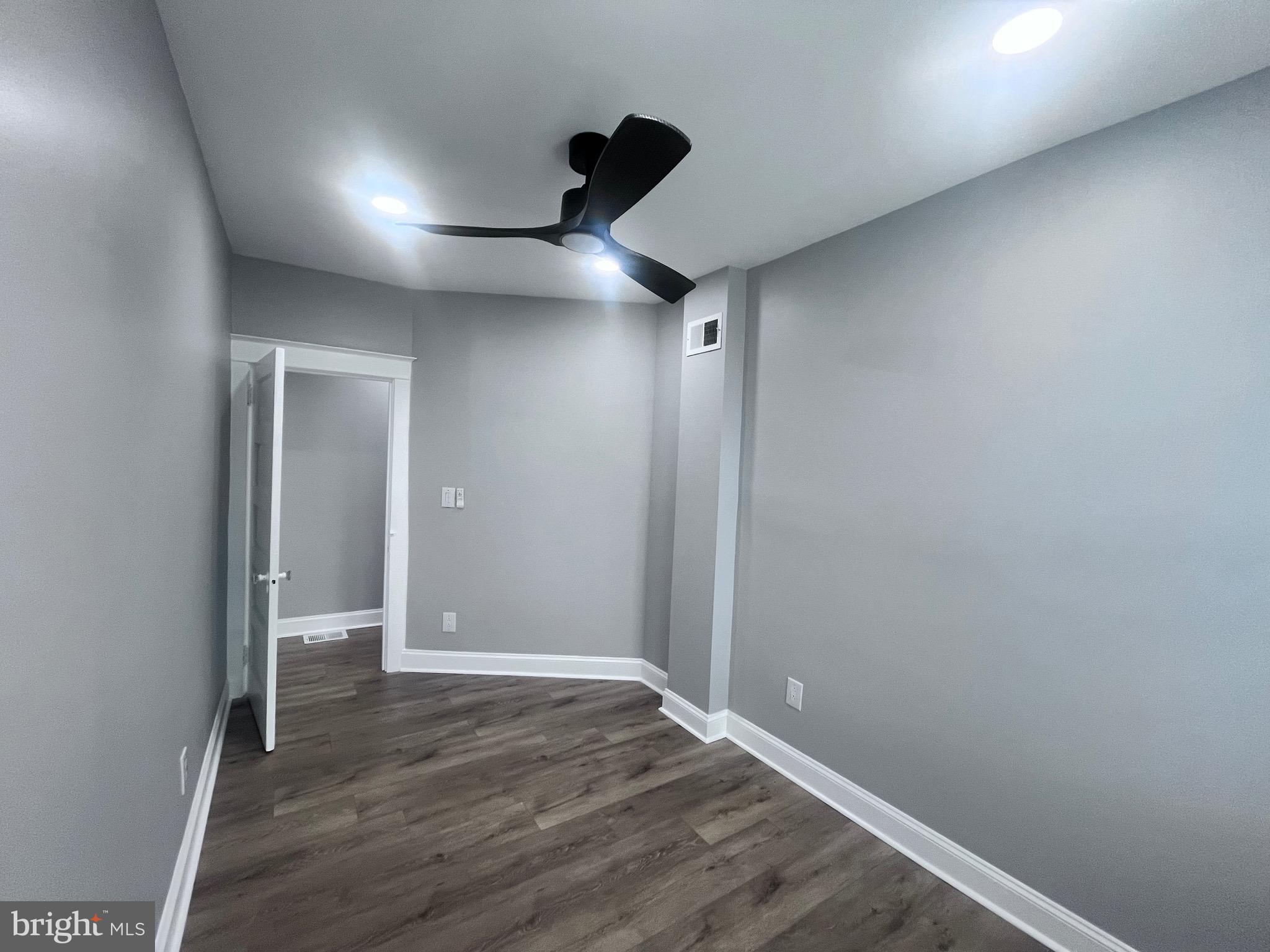 2520 West Seybert Street Philadelphia, PA 19121 - Photo 39 of 40 a view of an empty room and wooden floor