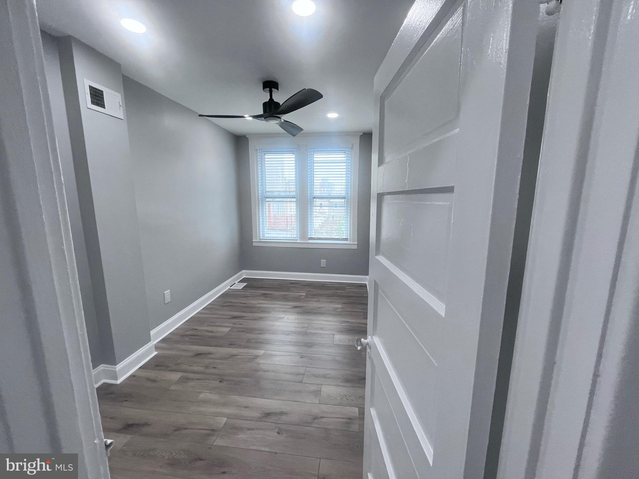 2520 West Seybert Street Philadelphia, PA 19121 - Photo 40 of 40 a view of empty room with wooden floor and fan