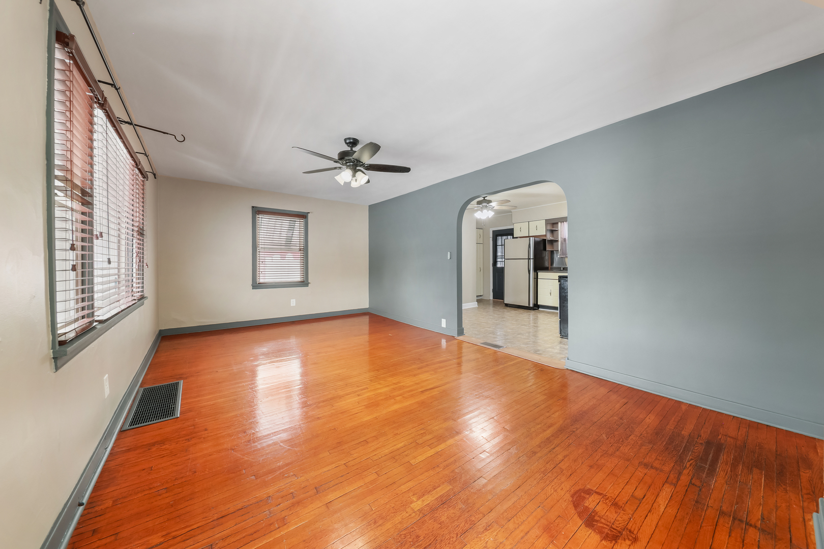 1428 Pickwick Street Ottawa, IL 61350 - Photo 4 of 14 a view of empty room with wooden floor and fan