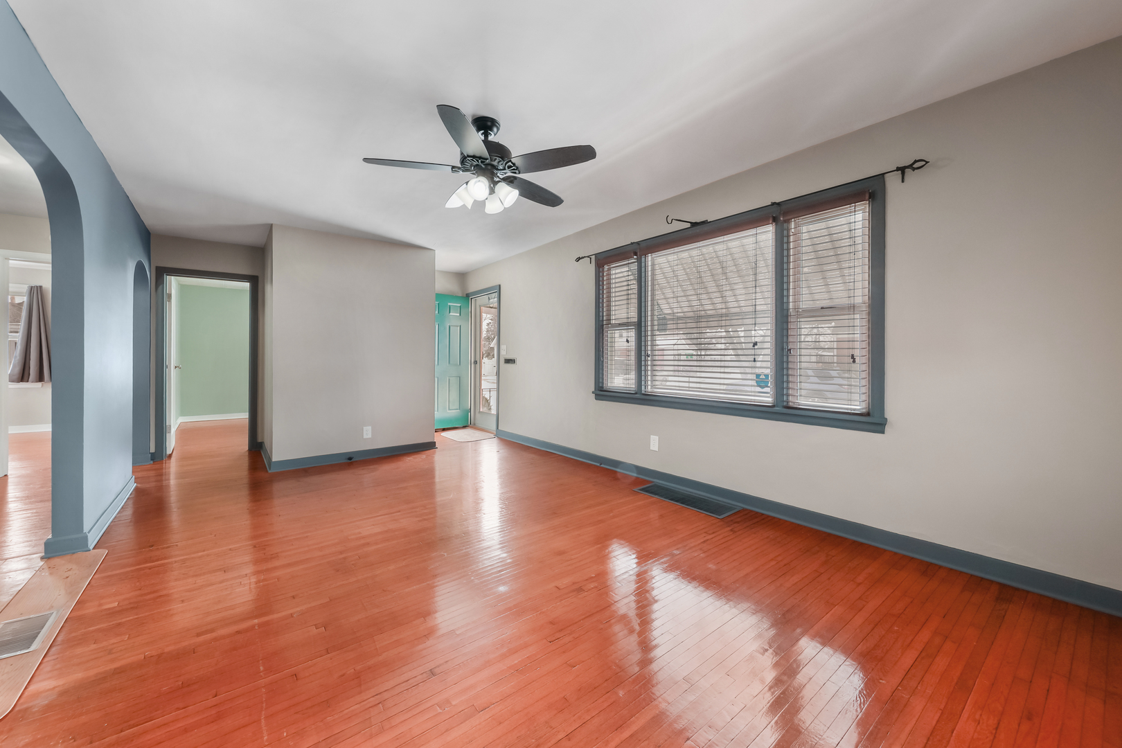 1428 Pickwick Street Ottawa, IL 61350 - Photo 6 of 14 a view of empty room with wooden floor and fan
