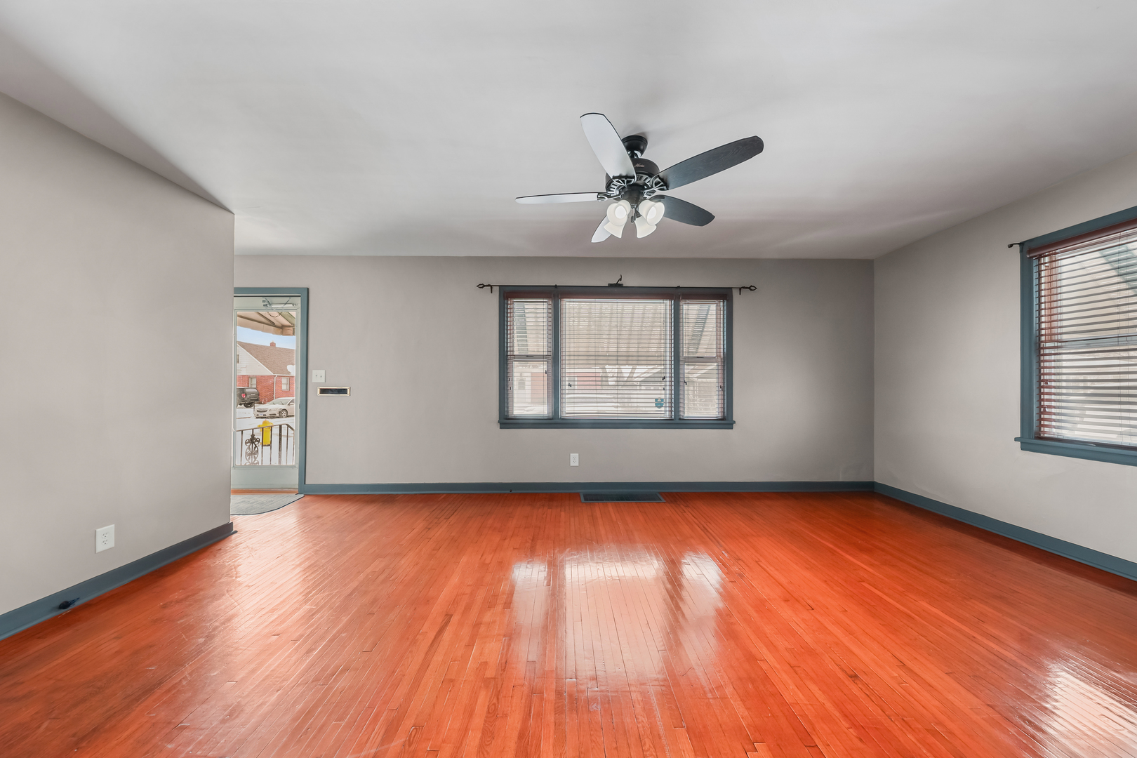 1428 Pickwick Street Ottawa, IL 61350 - Photo 7 of 14 a view of empty room with wooden floor and fan