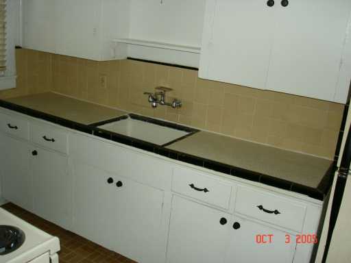 Undisclosed Address Corpus Christi, TX 78404 - Photo 3 of 8 a close up of a sink and a stove in a room