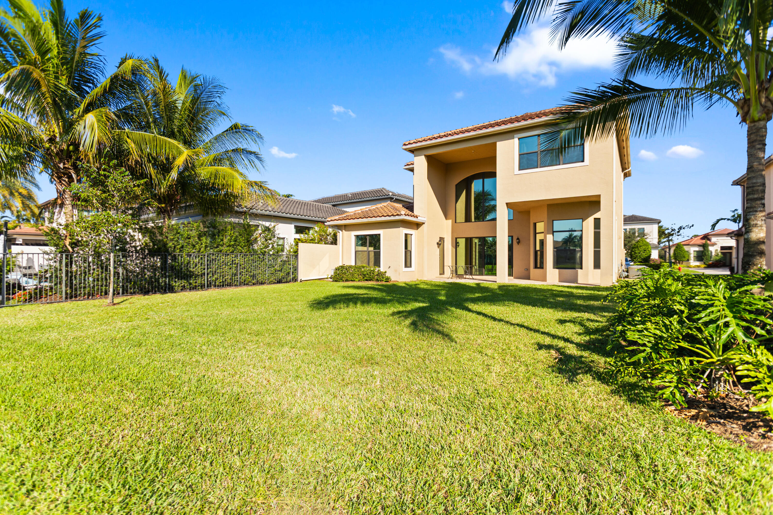 16743 Picardy Way Delray Beach, FL 33446 - Photo 50 of 79 a front view of a house with a garden