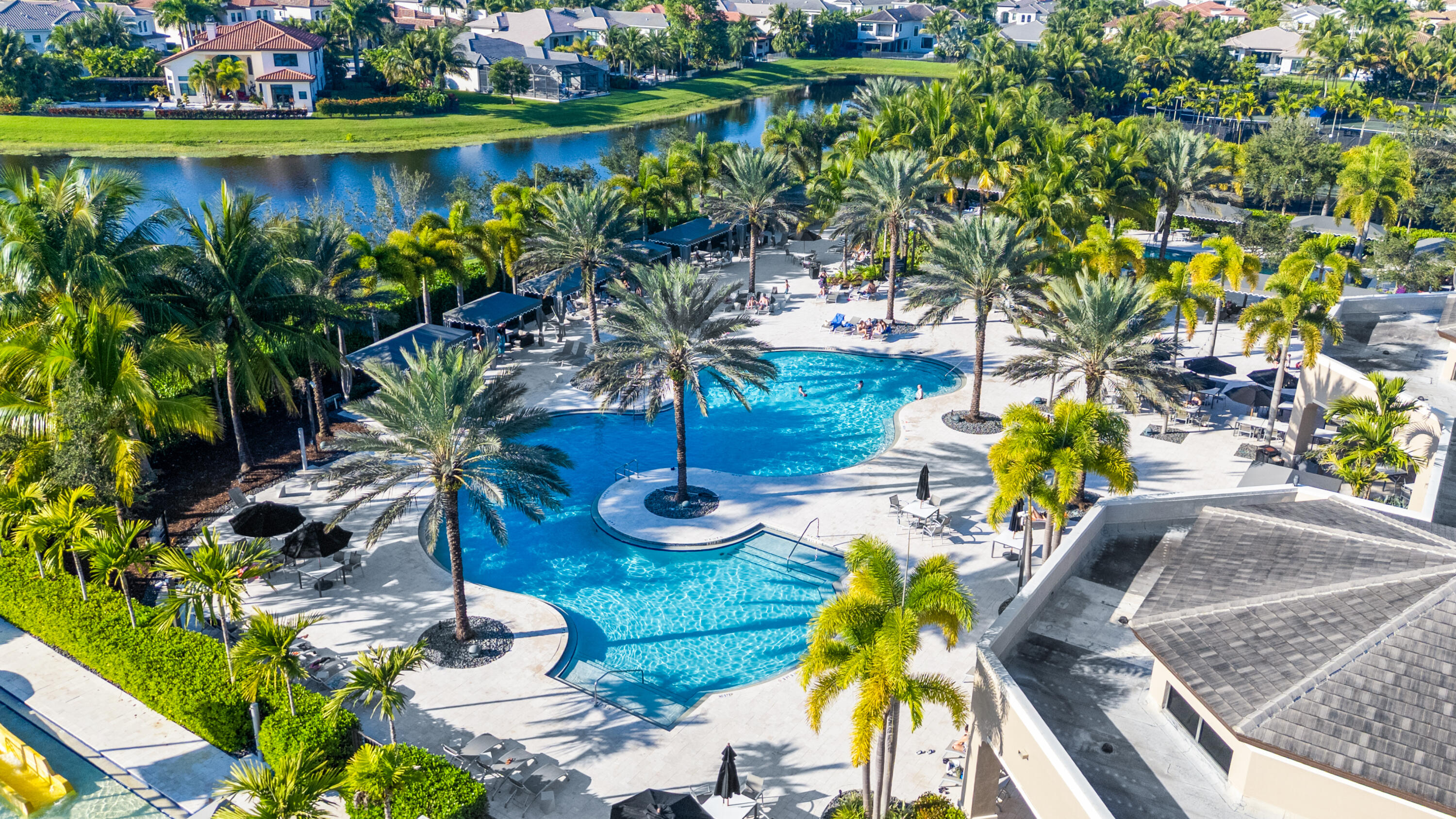 16743 Picardy Way Delray Beach, FL 33446 - Photo 5 of 79 a view of a swimming pool with a patio and a garden