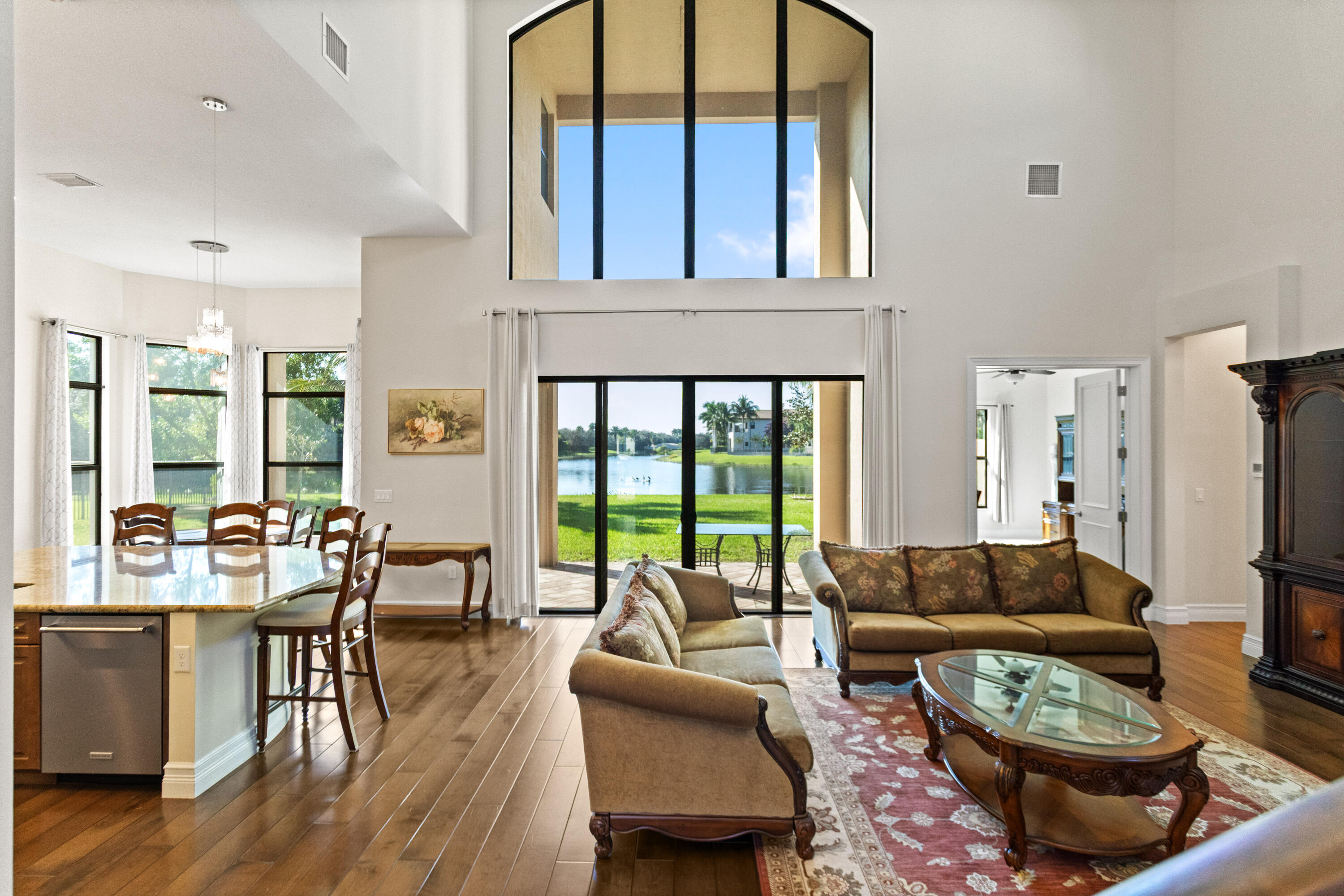 16743 Picardy Way Delray Beach, FL 33446 - Photo 8 of 79 a living room with furniture and a large window