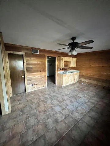 a view of a room with a refrigerator