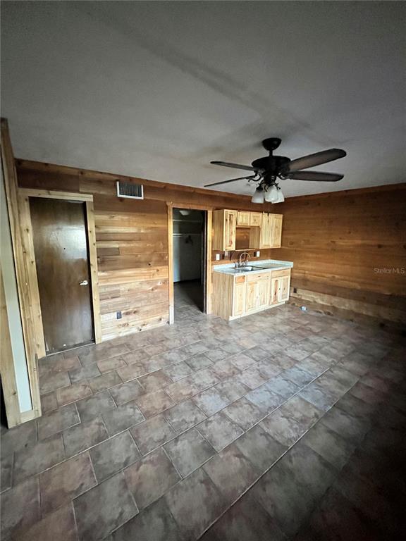 941 Mill Rd Lane Port Orange, FL 32127 - Photo 19 of 24 a view of a room with a refrigerator