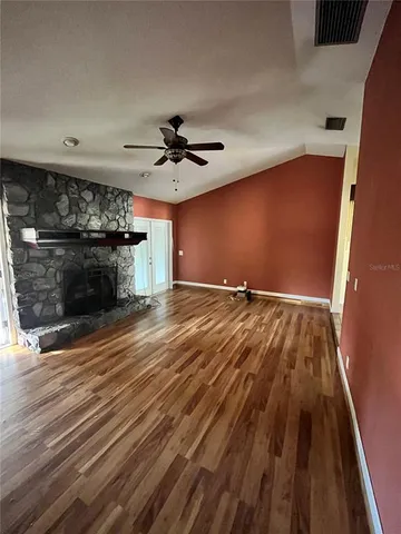 a view of a livingroom with wooden floor