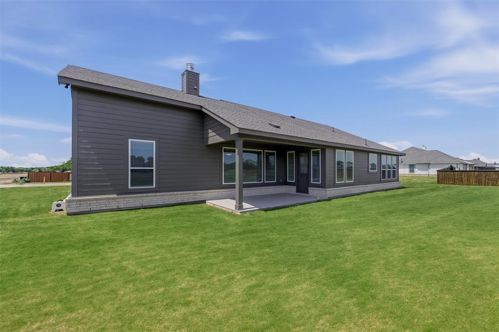 2627 Witness Tree Road Terrell, TX 75161 - Photo 24 of 27 a view of a house with a backyard