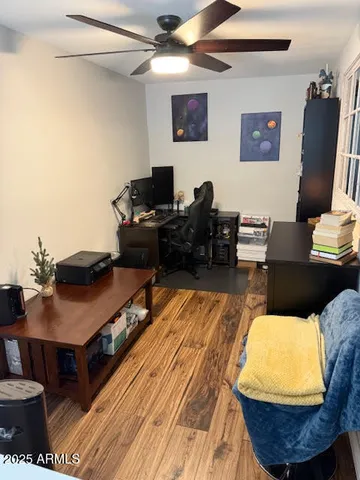 a view of a patio with table and chairs potted plants under an umbrella
