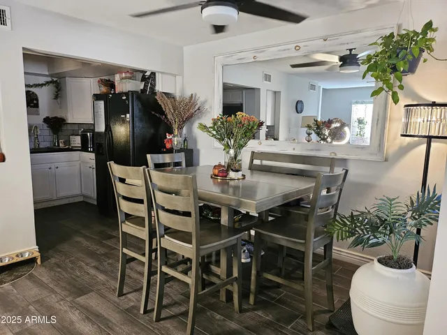 a dining room with furniture and window