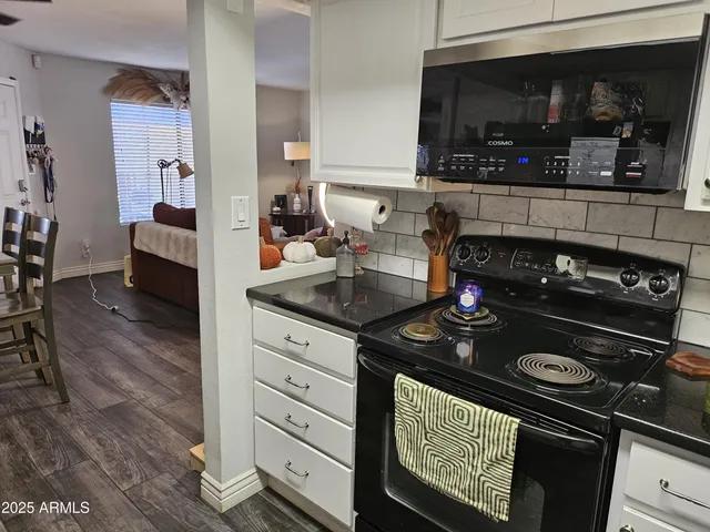 a kitchen with a stove and a microwave