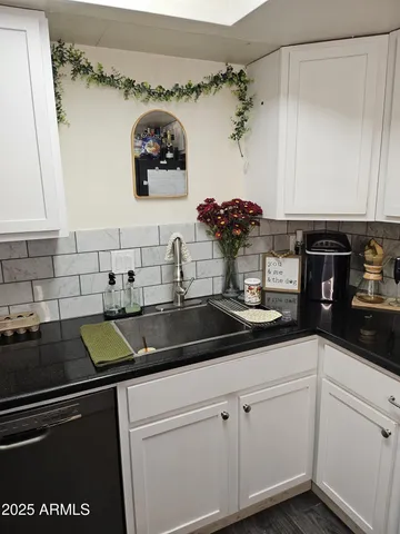 a kitchen with a sink and a stove