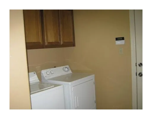 a view of a porch with chairs and backyard