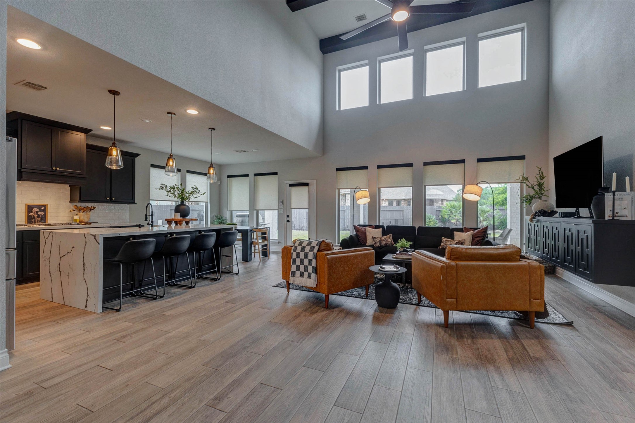 4303 Tupelo Leaf Court Manvel, TX 77578 - Photo 16 of 50 a living room with fireplace furniture and a flat screen tv