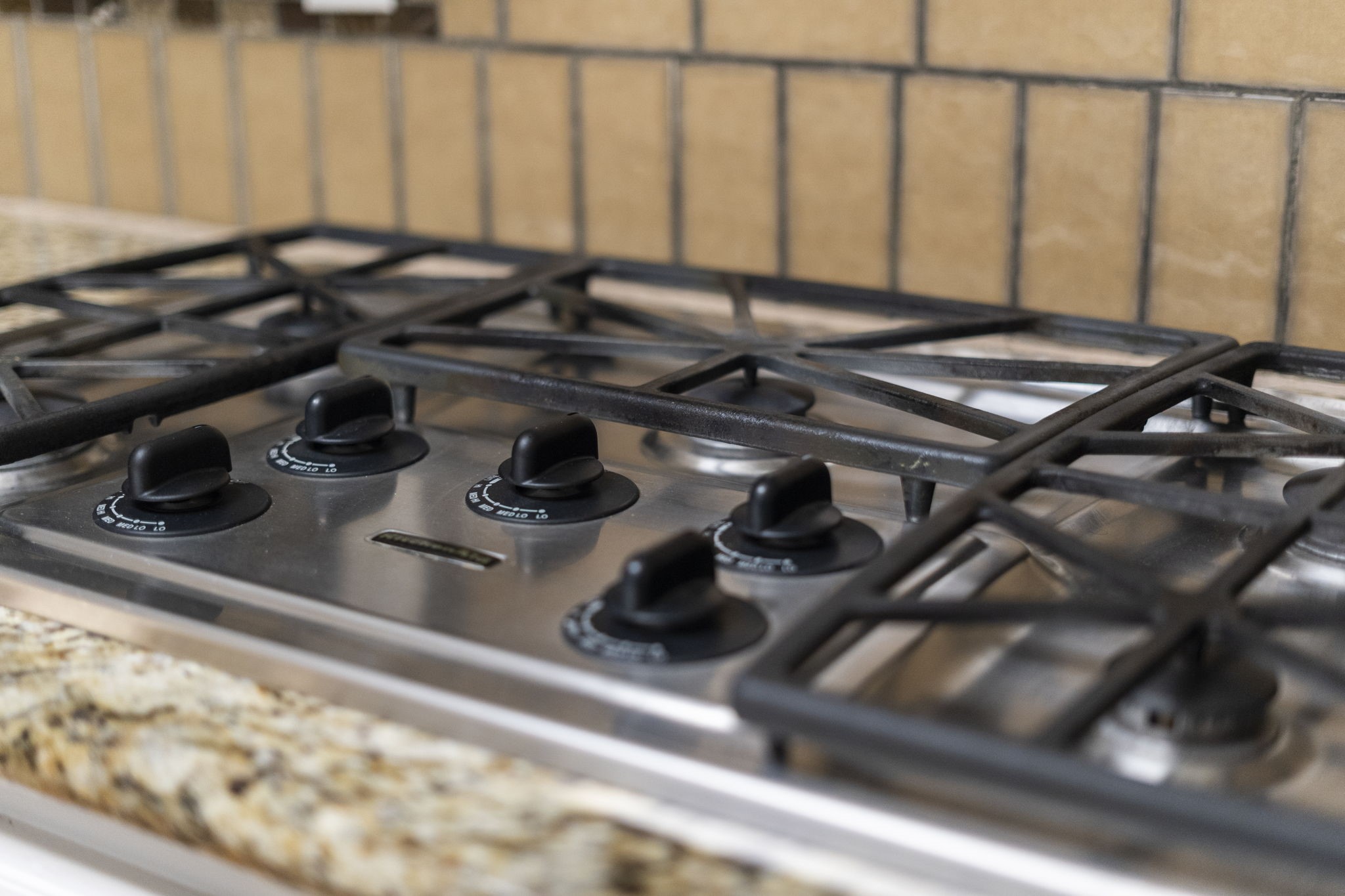 6102 Redding Road Houston, TX 77036 - Photo 19 of 40 The chef will love cooking on the KitchenAid 5-burner gas cooktop.