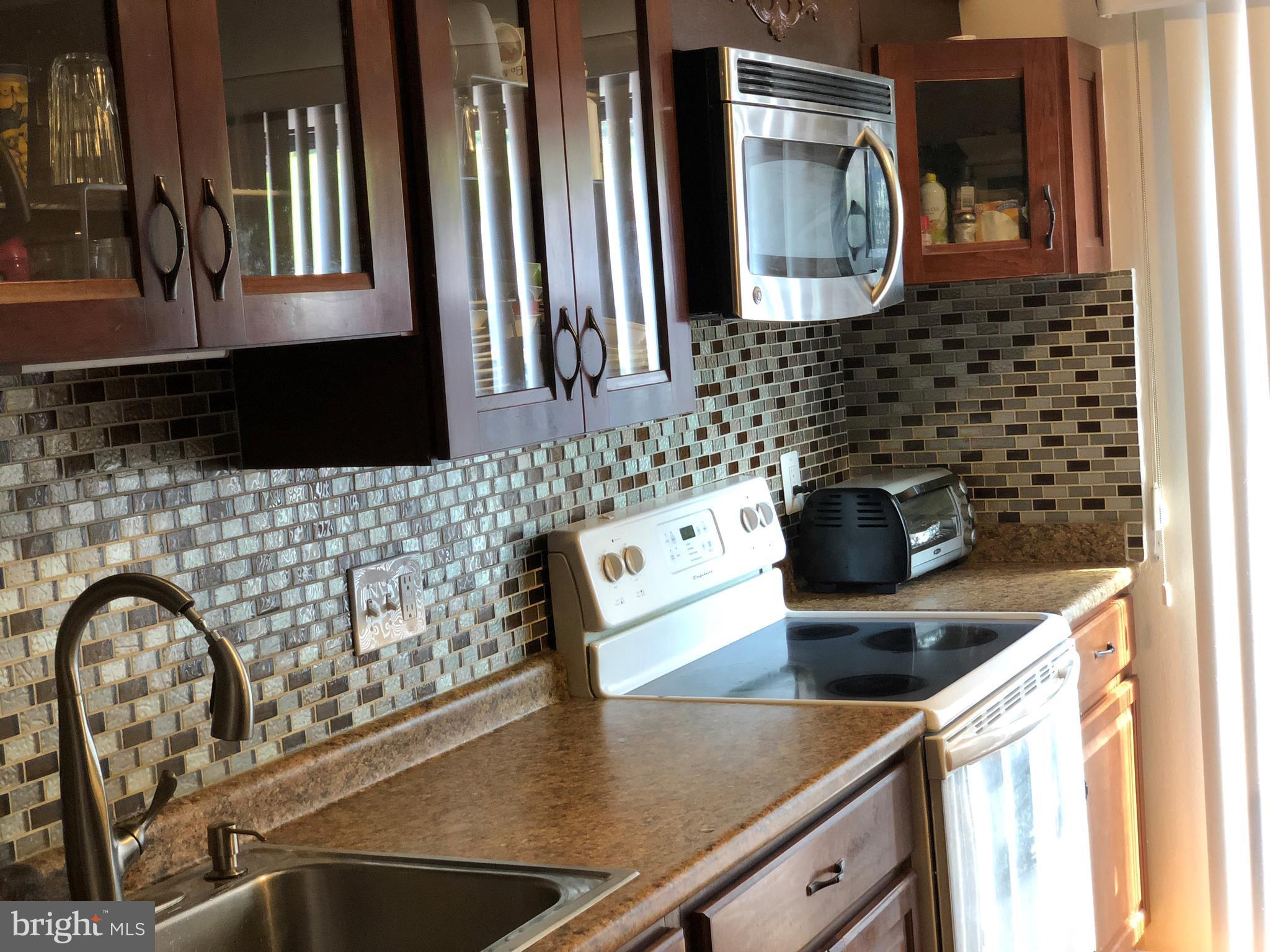 8989 Centerway Road Gaithersburg, MD 20879 - Photo 5 of 26 a close view of sink and tap