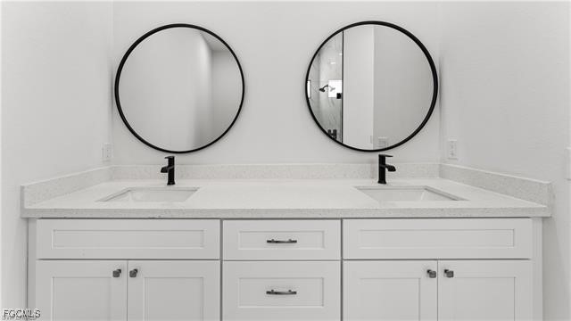 729 Giorgio Avenue Lehigh Acres, FL 33974 - Photo 14 of 21 a bathroom with a sink and a mirror