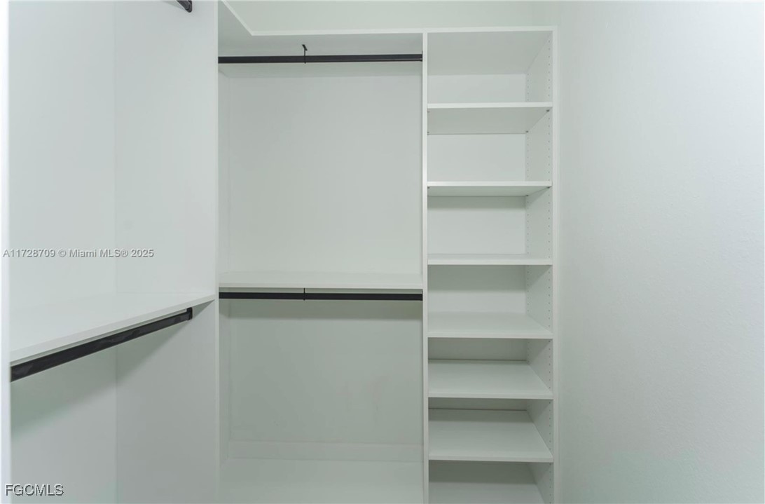 729 Giorgio Avenue Lehigh Acres, FL 33974 - Photo 15 of 21 a view of an empty walk in closet