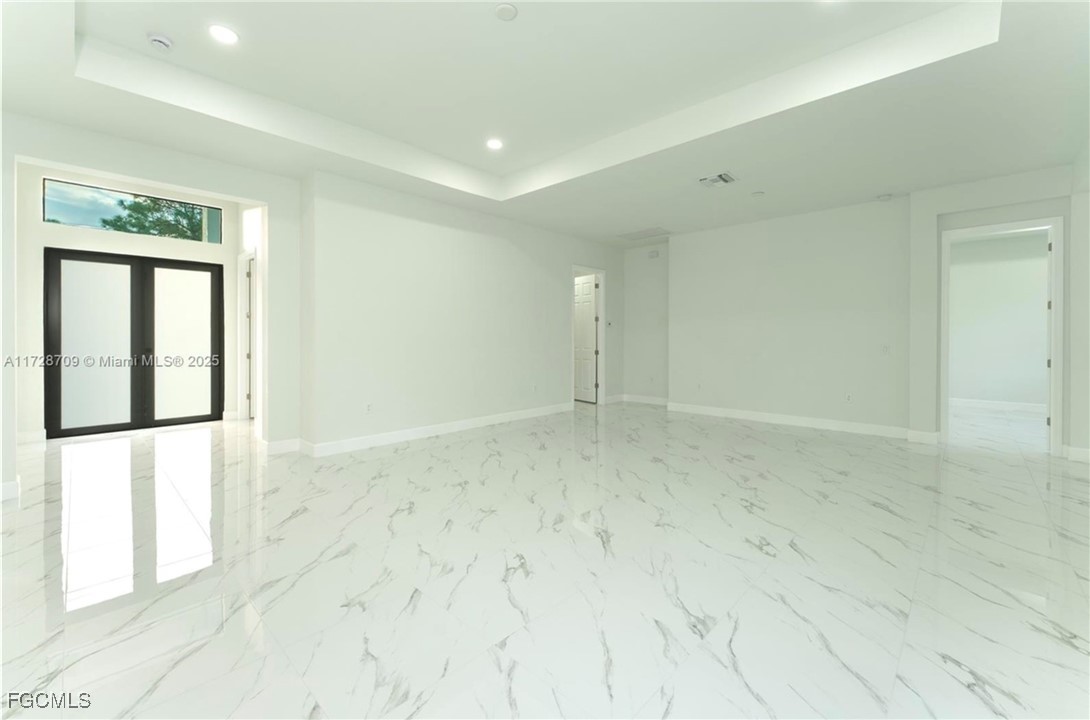 729 Giorgio Avenue Lehigh Acres, FL 33974 - Photo 16 of 21 a view of an empty room