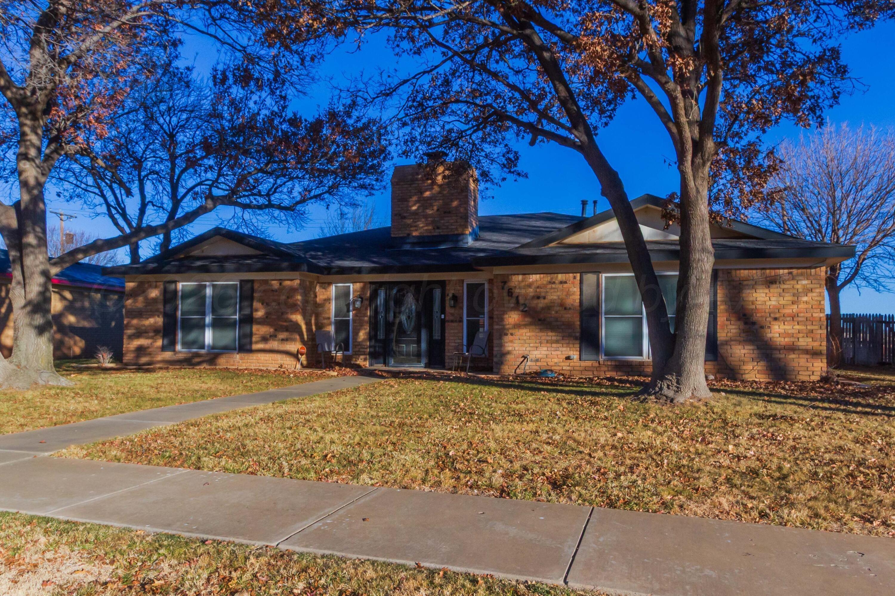 7612 Farrell Drive Amarillo, TX 79121 - Photo 1 of 27 a front view of a house with a garden